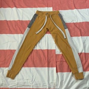 Mustard yellow sweat pants.